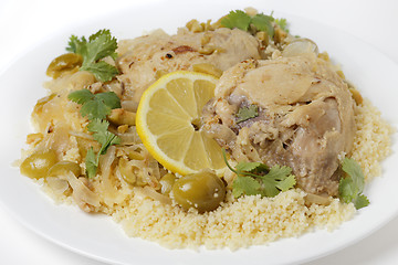 Image showing Citrus chicken with olives and couscous