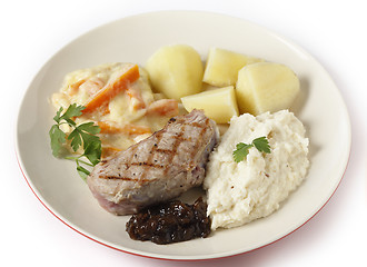 Image showing Veal steak with gourmet vegetables side view