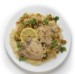 Image showing Citrus chicken with olives and couscous from above