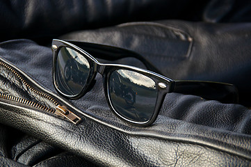 Image showing leather jacket detail with sunglasses