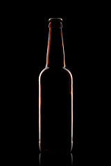 Image showing Beer bottle isolated on black