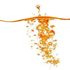 Image showing orange water splash isolated on white