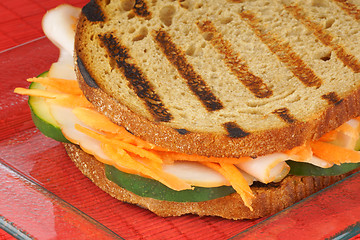 Image showing Roasted turkey and vegetables sandwich close-up