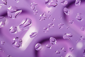 Image showing violet abstract background with water drops