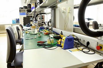 Image showing electronics equipment assembly workplace