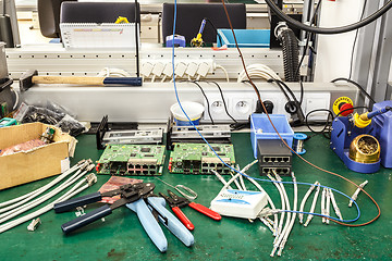 Image showing electronics equipment assembly workplace