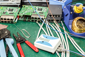 Image showing electronics equipment assembly workplace