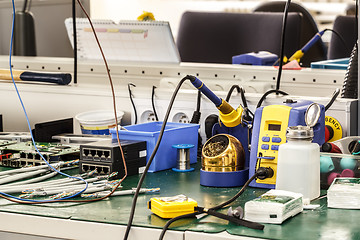 Image showing electronics equipment assembly workplace