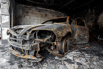 Image showing Close up photo of a burned out cars