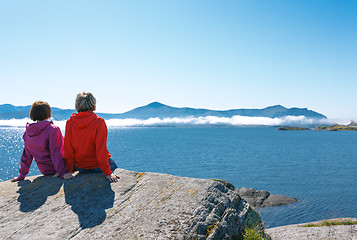 Image showing Two women enjoying view at fjord