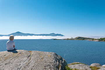 Image showing Little boy enjoying view at fjord