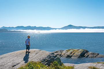 Image showing Little boy enjoying view at fjord