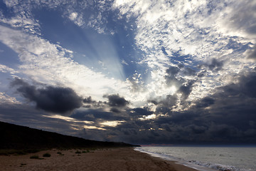 Image showing Sea beach in evening and sunlight clouds
