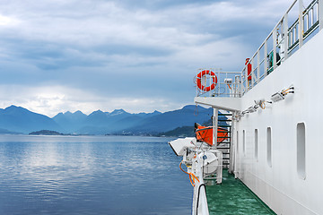 Image showing Ferry ship sailing in still water of a fjord