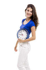 Image showing Beautiful woman with a clock