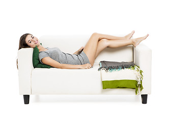 Image showing Beautiful woman relaxing on a sofa