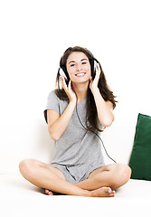 Image showing Beautiful woman listen music