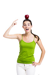 Image showing Healthy woman pointing to a apple