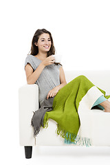 Image showing Drinking tea on the sofa