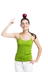 Image showing Healthy woman pointing to a apple