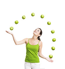 Image showing Woman throwing apples