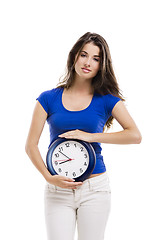 Image showing Beautiful woman with a clock