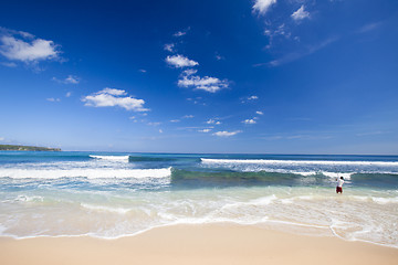 Image showing A local fishing in a tropical beach