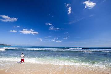 Image showing A local fishing in a tropical beach