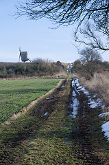 Image showing Windmill at a dirt road in springtime