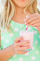 Image showing Smoothie drink held by young girl