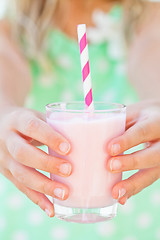 Image showing Smoothie drink held by young girl