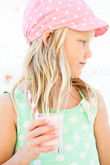 Image showing Young girl holding smoothie drink