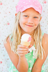 Image showing Young girl holding ice cream cone