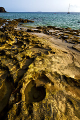 Image showing rock beach  water boat  and summer in lanzarote spain