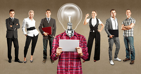 Image showing Business Team With Lamp Head