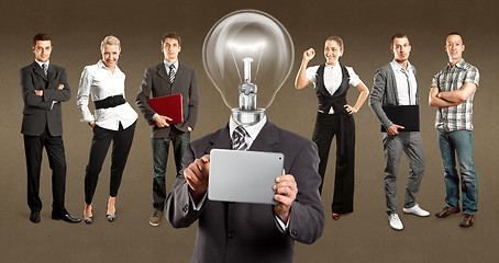 Image showing Business Team With Lamp Head