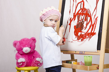 Image showing Girl, the artist draws on easel bear