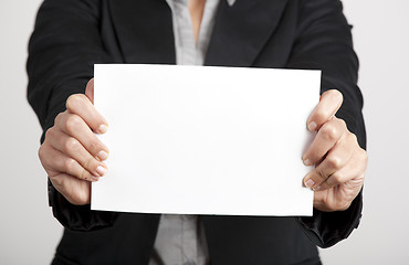 Image showing Holding a paper card