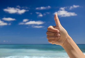 Image showing Thumbs up against a blue sky