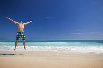 Image showing Man jumping on the beach