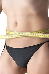 Image showing Measuring tape around belly