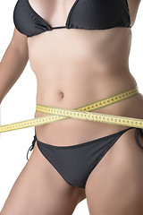 Image showing Measuring tape around belly