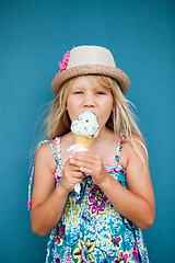 Image showing Young girl eating ice cream