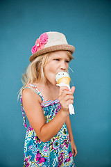 Image showing Young girl eating ice cream