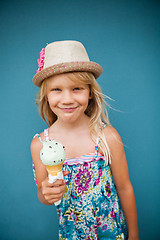 Image showing Young girl holding ice cream cone