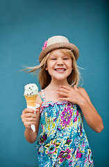 Image showing Young girl holding ice cream cone