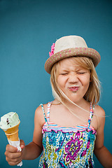 Image showing Young girl holding ice cream cone
