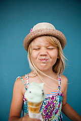 Image showing Young girl holding ice cream cone