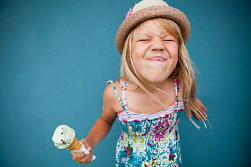 Image showing Young girl holding ice cream cone