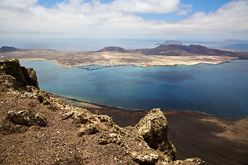 Image showing harbor rock stone sky cloud beach   spain graciosa miramar del r